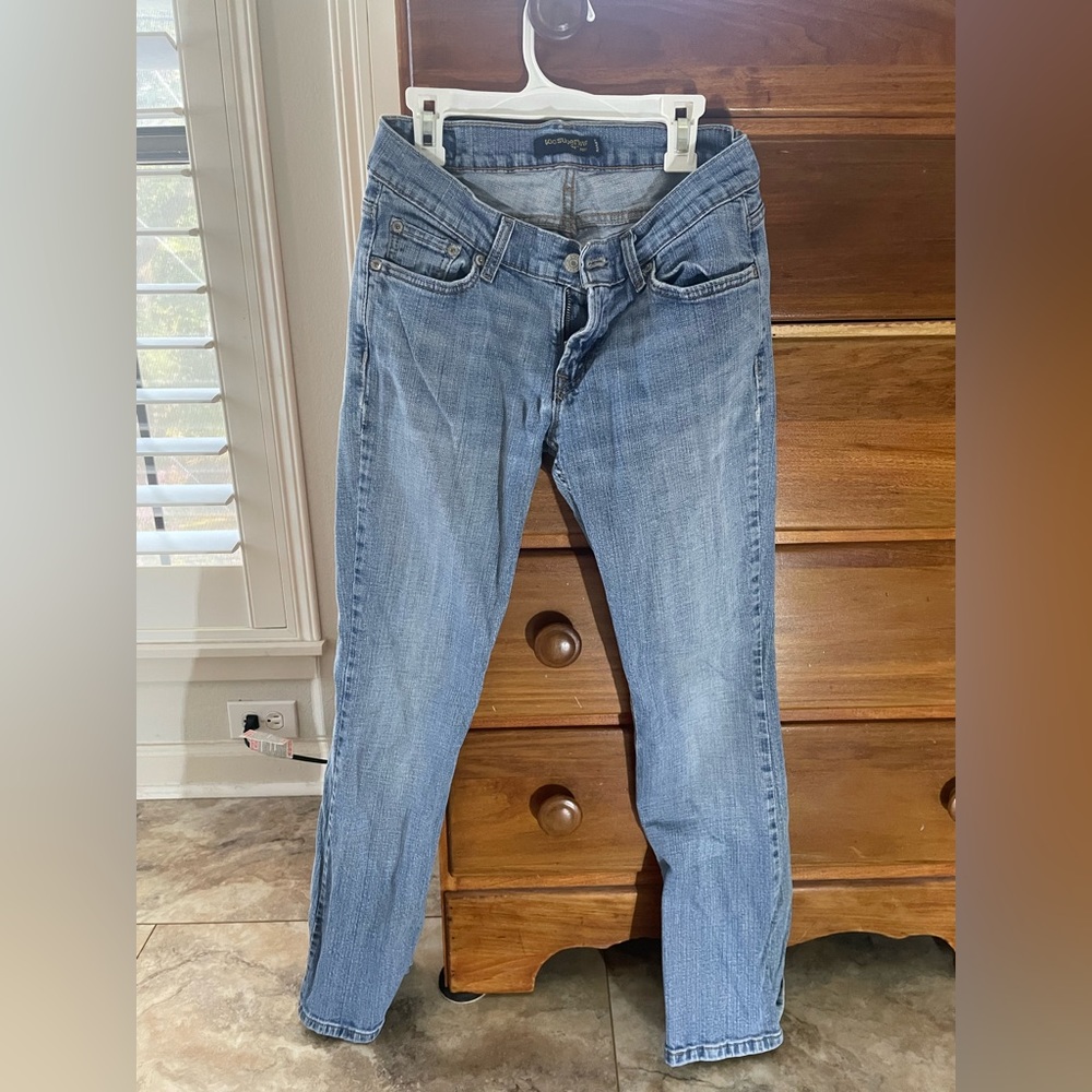 Low rise Levi jeans. Slight flare at the bottom.